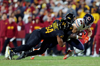 Oct 27, 2024; Landover, Maryland, USA; Chicago Bears tight end Cole Kmet (85) catches a pass against Washington Commanders linebacker Bobby Wagner (54) during the fourth quarter at Commanders Field. Mandatory Credit: Peter Casey-Imagn Images