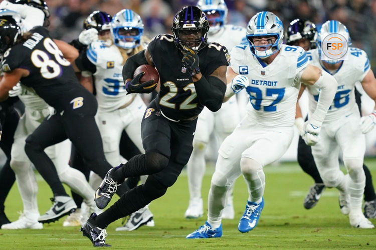 Sep 22, 2025; Baltimore, Maryland, USA; Baltimore Ravens running back Derrick Henry (22) rushes the ball against the Detroit Lions during the first half at M&T Bank Stadium. Credit: Mitch Stringer-Imagn Images