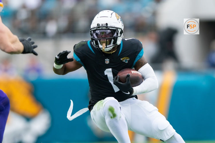 Nov 10, 2024; Jacksonville, Florida, USA; Jacksonville Jaguars running back Travis Etienne Jr (1) runs the ball after the catch agains the Minnesota Vikings in the first quarter at EverBank Stadium. Credit: Jeremy Reper-Imagn Images