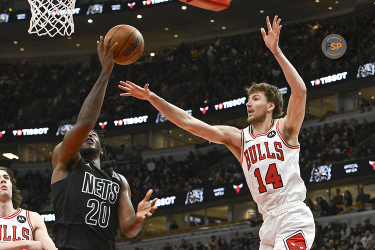 Dec 2, 2024; Chicago, Illinois, USA;  Brooklyn Nets center Day'Ron Sharpe (20) shoots against Chicago Bulls forward Matas Buzelis (14) during the second half at the United Center. Credit: Matt Marton-Imagn Images