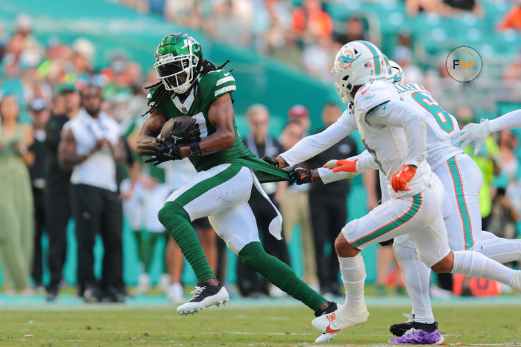 Dec 8, 2024; Miami Gardens, Florida, USA; New York Jets wide receiver Davante Adams (17) runs with the football against the Miami Dolphins during the third quarter at Hard Rock Stadium. Credit: Sam Navarro-Imagn Images