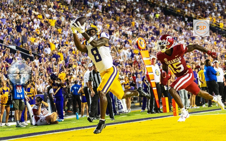 BATON ROUGE, LA - SEPTEMBER 23: LSU Tigers wide receiver Malik Nabers (8) catches a touchdown pass during a game between the LSU Tigers and the Arkansas Razorbacks on September 23, 2023, at Tiger Stadium in Baton Rouge, Louisiana. (Photo by John Korduner/Icon Sportswire)