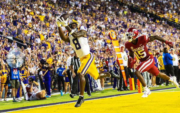 BATON ROUGE, LA - SEPTEMBER 23: LSU Tigers wide receiver Malik Nabers (8) catches a touchdown pass during a game between the LSU Tigers and the Arkansas Razorbacks on September 23, 2023, at Tiger Stadium in Baton Rouge, Louisiana. (Photo by John Korduner/Icon Sportswire)