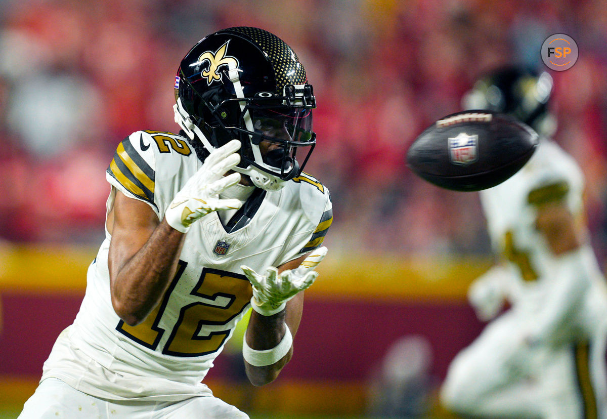 Oct 7, 2024; Kansas City, Missouri, USA; New Orleans Saints wide receiver Chris Olave (12) catches a pass during the second half against the Kansas City Chiefs at GEHA Field at Arrowhead Stadium. Credit: Jay Biggerstaff-Imagn Images