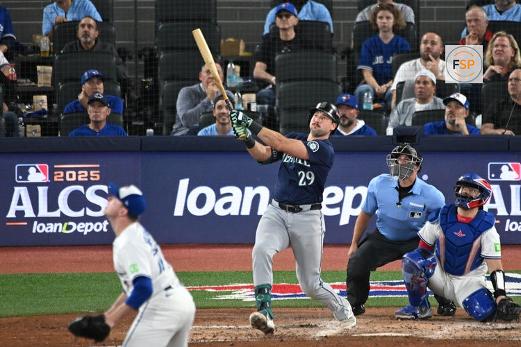 Oct 20, 2025; Toronto, Ontario, CAN; Seattle Mariners catcher Cal Raleigh (29) hits a solo home run against the Toronto Blue Jays in the fifth inning during game seven of the ALCS round for the 2025 MLB playoffs at Rogers Centre. Credit: Dan Hamilton-Imagn Images