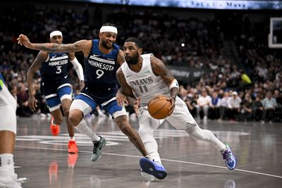 Jan 22, 2025; Dallas, Texas, USA; Dallas Mavericks guard Kyrie Irving (11) drives to the basket past Minnesota Timberwolves guard Nickeil Alexander-Walker (9) during the second half at the American Airlines Center. Mandatory Credit: Jerome Miron-Imagn Images