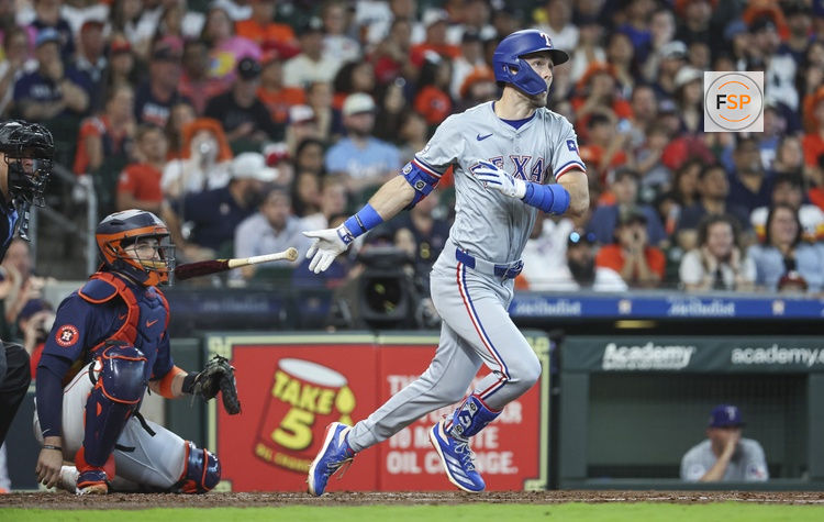 Apr 14, 2024; Houston, Texas, USA; Texas Rangers left fielder Evan Carter (32) hits a home run during the fourth inning against the Houston Astros at Minute Maid Park. Credit: Troy Taormina-USA TODAY Sports