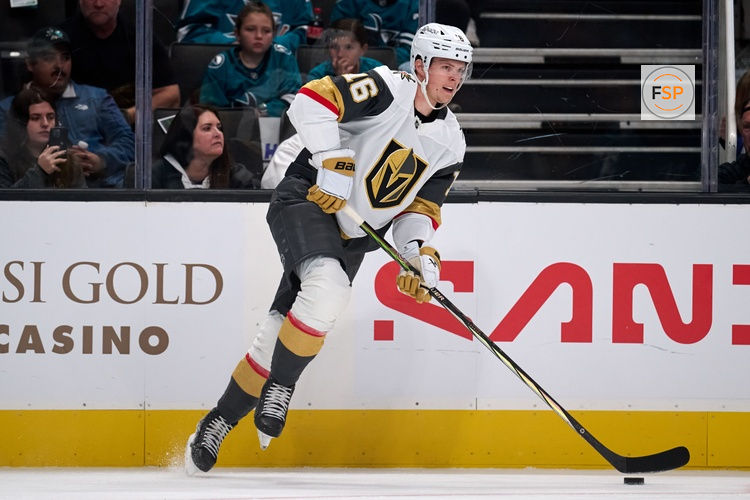 Oct 9, 2025; San Jose, California, USA; Vegas Golden Knights right wing Pavel Dorofeyev (16) plays the puck along the boards against the San Jose Sharks during the first period at SAP Center at San Jose. Credit: Robert Edwards-Imagn Images