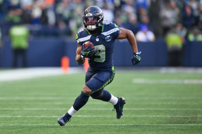 Jan 25, 2026; Seattle, WA, USA; Seattle Seahawks running back Kenneth Walker III (9) runs against the Los Angeles Rams in the first half in the 2026 NFC Championship Game at Lumen Field. Mandatory Credit: Steven Bisig-Imagn Images