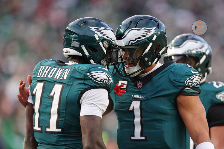 Jan 26, 2025; Philadelphia, PA, USA; Philadelphia Eagles quarterback Jalen Hurts (1) and wide receiver A.J. Brown (11) celebrate after a touchdown against the Washington Commanders during the first half in the NFC Championship game at Lincoln Financial Field. Credit: Bill Streicher-Imagn Images