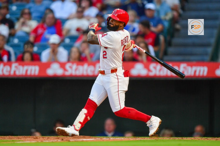 Jul 30, 2025; Anaheim, California, USA; Los Angeles Angels second baseman Luis Rengifo (2) hits an RBI single against the Texas Rangers during the fourth inning at Angel Stadium. Credit: Gary A. Vasquez-Imagn Images