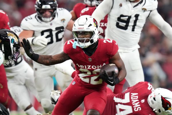 Arizona Cardinals running back Michael Carter (22) breaks out of the backfield against the Jacksonville Jaguars at State Farm Stadium on Nov. 23, 2025.