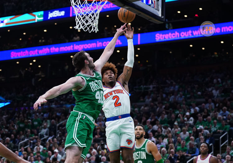 Oct 22, 2024; Boston, Massachusetts, USA; New York Knicks guard Miles McBride (2) shoots against Boston Celtics center Luke Kornet (40) in the second half at TD Garden. Credit: David Butler II-Imagn Images