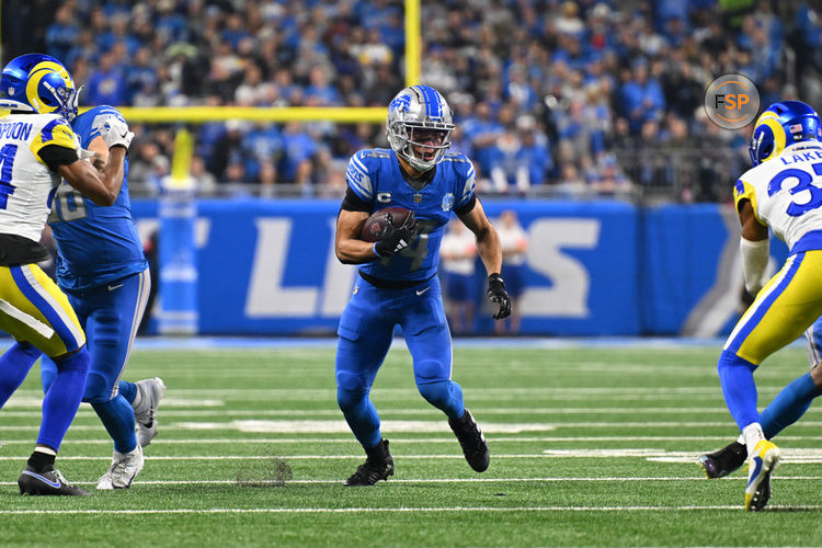 DETROIT, MI - JANUARY 14: Detroit Lions wide receiver Amon-Ra St. Brown (14) hauls in a catch for a first down during the NFC Wild Card game between the Detroit Lions and the Los Angeles Rams game on Sunday January 14, 2023 at Ford Field in Detroit, MI. (Photo by Steven King/Icon Sportswire)