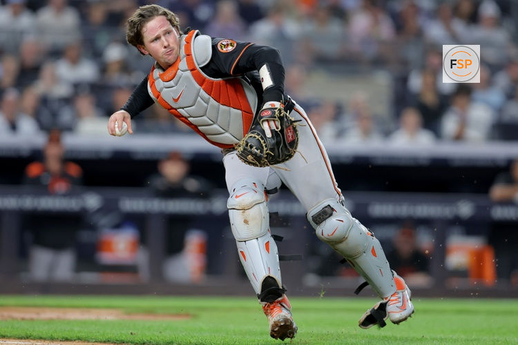 Sep 26, 2025; Bronx, New York, USA; Baltimore Orioles catcher Adley Rutschman (35) throws out New York Yankees second baseman Jose Caballero (not pictured) on a ground ball during the sixth inning at Yankee Stadium. Credit: Brad Penner-Imagn Images