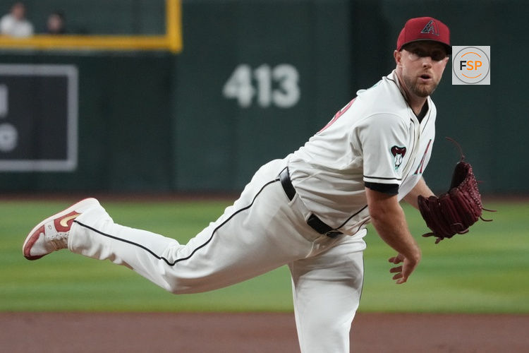 Jul 22, 2026; Phoenix, Arizona, USA; Arizona Diamondbacks pitcher Merrill Kelly (29) throws a pitch against the Athletics in the first inning at Chase Field. Credit: Rick Scuteri-Imagn Images