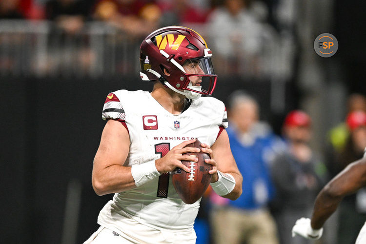 ATLANTA, GA – OCTOBER 15:  Washington quarterback Sam Howell (14) drops back to pass during the NFL game between the Washington Commanders and the Atlanta Falcons on October 15th, 2023 at Mercedes-Benz Stadium in Atlanta, GA.  (Photo by Rich von Biberstein/Icon Sportswire)