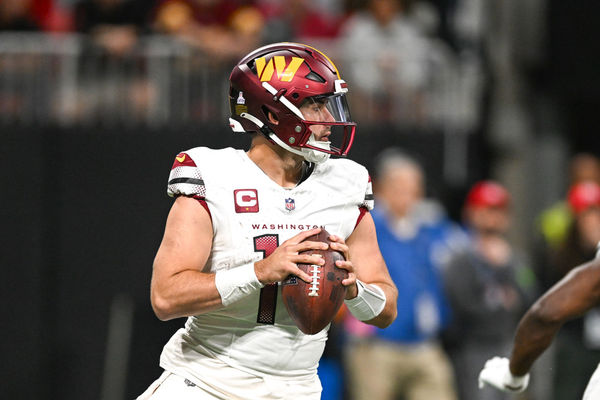 ATLANTA, GA – OCTOBER 15:  Washington quarterback Sam Howell (14) drops back to pass during the NFL game between the Washington Commanders and the Atlanta Falcons on October 15th, 2023 at Mercedes-Benz Stadium in Atlanta, GA.  (Photo by Rich von Biberstein/Icon Sportswire)