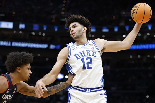 Mar 29, 2026; Washington, DC, USA; Duke Blue Devils forward Cameron Boozer (12) grabs the ball in front of UConn Huskies forward Jaylin Stewart (3) in the first half during an Elite Eight game of the East Regional of the men's 2026 NCAA Tournament at Capital One Arena. Mandatory Credit: Amber Searls-Imagn Images