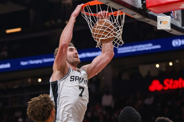 Dec 19, 2025; Atlanta, Georgia, USA; San Antonio Spurs center Luke Kornet (7) dunks against the Atlanta Hawks in the first quarter at State Farm Arena. Credit: Brett Davis-Imagn Images
