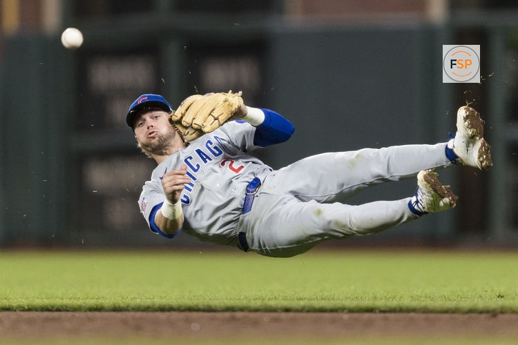 Jun 12, 2026; San Francisco, California, USA; Chicago Cubs second baseman Nico Hoerner (2) throws to first base against the San Francisco Giants after committing an error during the sixth inning at Oracle Park. Credit: John Hefti-Imagn Images