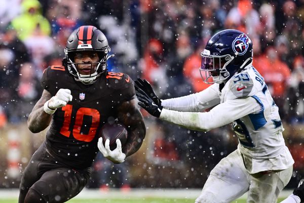 Dec 7, 2025; Cleveland, Ohio, USA; Cleveland Browns running back Quinshon Judkins (10) runs with the ball as Tennessee Titans cornerback Darrell Baker Jr. (39) defends during the third quarter at Huntington Bank Field. Mandatory Credit: Ken Blaze-Imagn Images