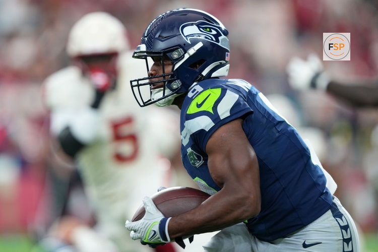 Sep 25, 2025; Glendale, Arizona, USA;  Seattle Seahawks running back Kenneth Walker III (9) runs the ball against the Arizona Cardinals in the first quarter at State Farm Stadium. Credit: Joe Camporeale-Imagn Images