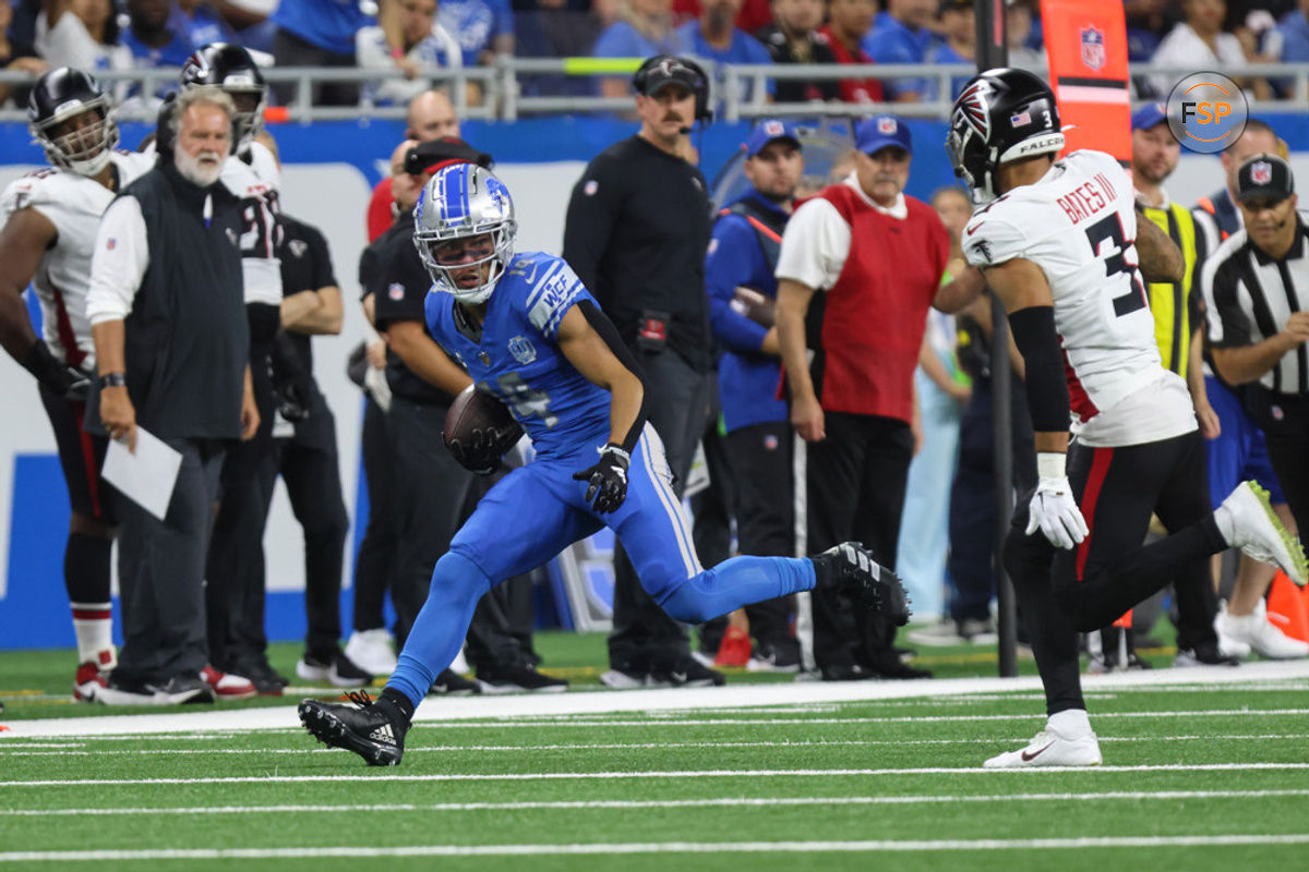 DETROIT, MI - SEPTEMBER 24:  Detroit Lions wide receiver Amon-Ra St. Brown (14) runs with the ball after catching a pass while Atlanta Falcons safety Jessie Bates III (3) pursues during the second quarter of an NFL football game between the Atlanta Falcons and the Detroit Lions on September 24, 2023 at Ford Field in Detroit, Michigan.  (Photo by Scott W. Grau/Icon Sportswire)