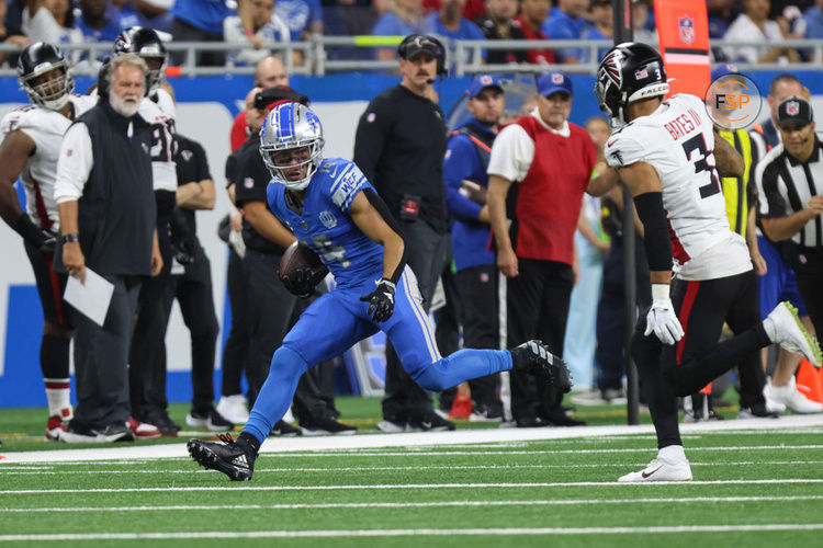 DETROIT, MI - SEPTEMBER 24:  Detroit Lions wide receiver Amon-Ra St. Brown (14) runs with the ball after catching a pass while Atlanta Falcons safety Jessie Bates III (3) pursues during the second quarter of an NFL football game between the Atlanta Falcons and the Detroit Lions on September 24, 2023 at Ford Field in Detroit, Michigan.  (Photo by Scott W. Grau/Icon Sportswire)