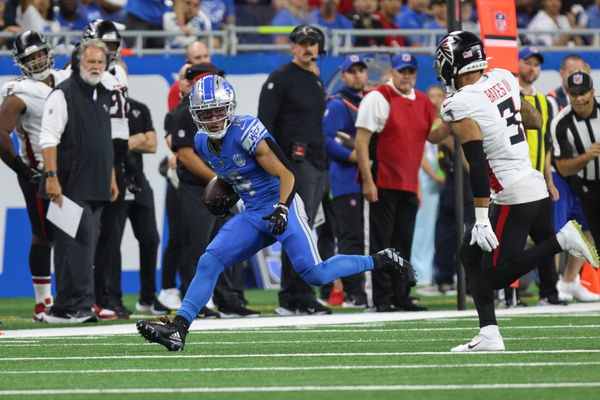 DETROIT, MI - SEPTEMBER 24:  Detroit Lions wide receiver Amon-Ra St. Brown (14) runs with the ball after catching a pass while Atlanta Falcons safety Jessie Bates III (3) pursues during the second quarter of an NFL football game between the Atlanta Falcons and the Detroit Lions on September 24, 2023 at Ford Field in Detroit, Michigan.  (Photo by Scott W. Grau/Icon Sportswire)