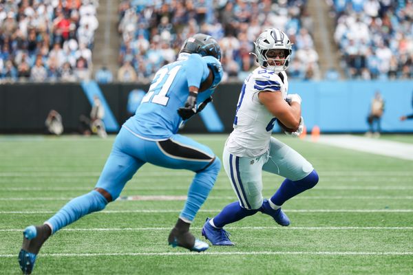 Oct 12, 2025; Charlotte, North Carolina, USA; Dallas Cowboys tight end Jake Ferguson (87) runs with the ball in the second half against the Carolina Panthers at Bank of America Stadium. Mandatory Credit: Cory Knowlton-Imagn Images