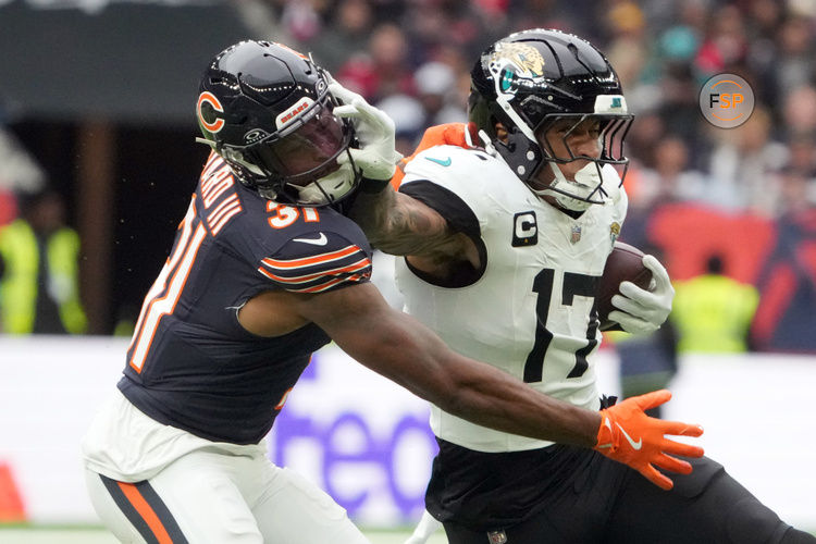 Oct 13, 2024; London, United Kingdom; Jacksonville Jaguars tight end Evan Engram (17) carries the ball against Chicago Bears safety Kevin Byard III (31) in the second half during an NFL International Series game at Tottenham Hotspur Stadium. Credit: Kirby Lee-Imagn Images