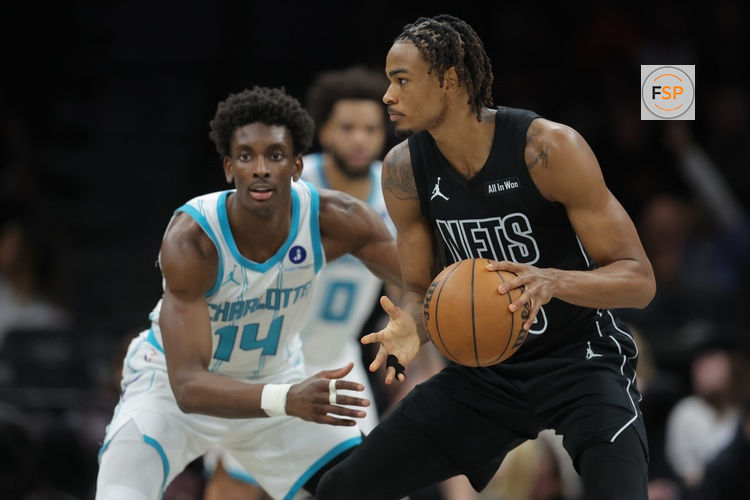 Mar 31, 2026; Brooklyn, New York, USA; Brooklyn Nets center Nic Claxton (33) controls the ball against Charlotte Hornets forward Moussa Diabate (14) during the third quarter at Barclays Center. Credit: Brad Penner-Imagn Images