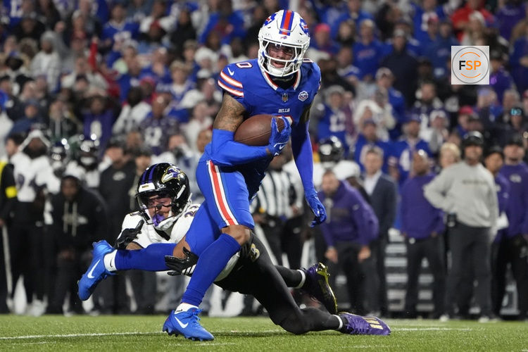 Sep 7, 2025; Orchard Park, New York, USA;  Buffalo Bills wide receiver Keon Coleman (0) runs the ball against Baltimore Ravens cornerback Jaire Alexander (23) during the fourth quarter at Highmark Stadium. Credit: Gregory Fisher-Imagn Images