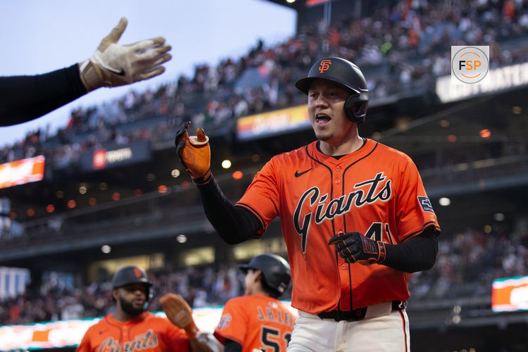 May 16, 2025; San Francisco, California, USA; San Francisco Giants first baseman Wilmer Flores (41) is greeted by his teammates after hitting a grand slam against the Athletics during the third inning at Oracle Park. Credit: D. Ross Cameron-Imagn Images