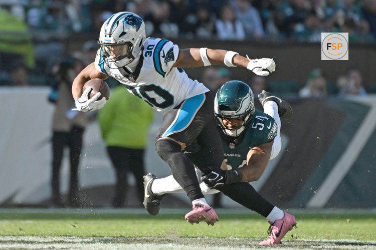 Oct 18, 2026; Philadelphia, Pennsylvania, USA; Carolina Panthers running back Chuba Hubbard (30) is tackled by Philadelphia Eagles linebacker Jeremiah Trotter Jr. (54) during the second half at Lincoln Financial Field. Credit: Eric Hartline-Imagn Images