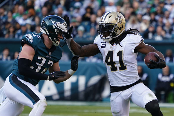 PHILADELPHIA, PA - JANUARY 01: New Orleans Saints Running Back Alvin Kamara (41) runs with the ball and straight arms Philadelphia Eagles Cornerback Mario Goodrich defending during the second half of the National Football League game between the New Orleans Saints and the Philadelphia Eagles on January 1, 2023, at Lincoln Financial Field in Philadelphia, PA. (Photo by Gregory Fisher/Icon Sportswire)