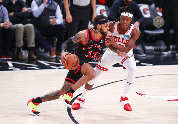 CHICAGO, IL - JANUARY 26: Toronto Raptors Guard Gary Trent Jr. (33) drives to the basket while being defended by Chicago Bulls Guard Ayo Dosunmu (12) during a NBA game between the Toronto Raptors and the Chicago Bulls on January 26, 2022 at the United Center in Chicago, IL. (Photo by Melissa Tamez/Icon Sportswire)