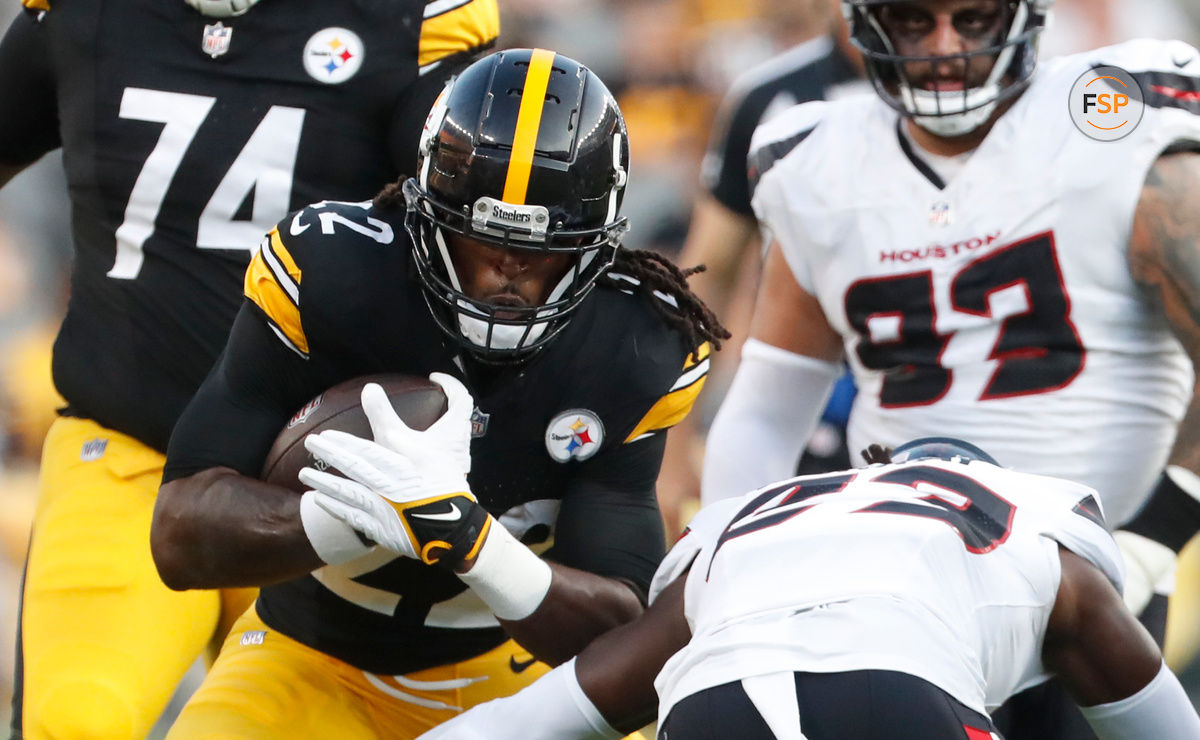 Aug 9, 2024; Pittsburgh, Pennsylvania, USA;  Pittsburgh Steelers running back Najee Harris (22) carries the ball against Houston Texans safety Eric Murray (23) during the first quarter at Acrisure Stadium. Credit: Charles LeClaire-USA TODAY Sports