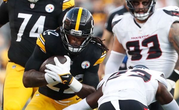 Aug 9, 2024; Pittsburgh, Pennsylvania, USA;  Pittsburgh Steelers running back Najee Harris (22) carries the ball against Houston Texans safety Eric Murray (23) during the first quarter at Acrisure Stadium. Mandatory Credit: Charles LeClaire-USA TODAY Sports