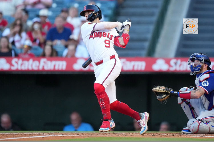 Jul 10, 2025; Anaheim, California, USA; Los Angeles Angels shortstop Zach Neto (9) hits a single in the first inning against the Texas Rangers at Angel Stadium. Credit: Kirby Lee-Imagn Images