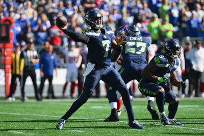 Oct 6, 2024; Seattle, Washington, USA; Seattle Seahawks quarterback Geno Smith (7) passes the ball against the New York Giants during the first half at Lumen Field. Mandatory Credit: Steven Bisig-Imagn Images