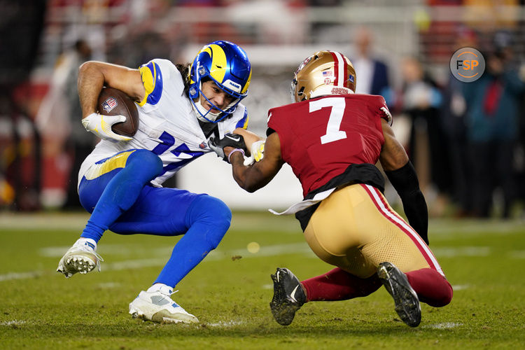 Dec 12, 2024; Santa Clara, California, USA; Los Angeles Rams wide receiver Puka Nacua (17) is tackled by San Francisco 49ers cornerback Charvarius Ward (7) after making a catch for a first down in the fourth quarter at Levi's Stadium. Credit: Cary Edmondson-Imagn Images