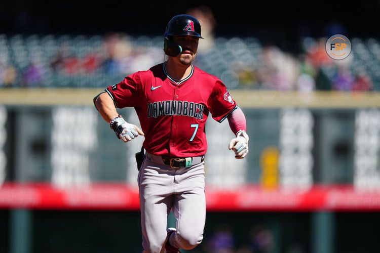 Sep 18, 2024; Denver, Colorado, USA; Arizona Diamondbacks outfielder Corbin Carroll (7) celebrates his solo home run in the first inning against the Colorado Rockies at Coors Field. Credit: Ron Chenoy-Imagn Images