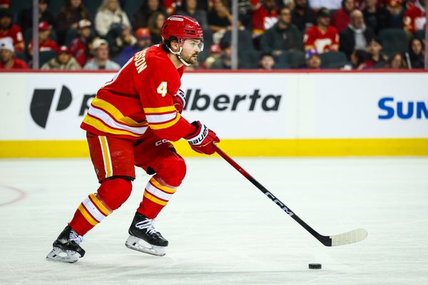Jan 17, 2026; Calgary, Alberta, CAN; Calgary Flames defenseman Rasmus Andersson (4) skates with the puck against the New York Islanders during the third period at Scotiabank Saddledome. Mandatory Credit: Sergei Belski-Imagn Images