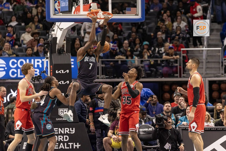 Nov 12, 2025; Detroit, Michigan, USA; Detroit Pistons forward Paul Reed (7) dunks the ball next to Chicago Bulls forward Isaac Okoro (35) during the second half at Little Caesars Arena. Credit: David Reginek-Imagn Images