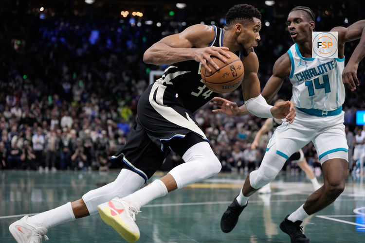 Nov 14, 2025; Milwaukee, Wisconsin, USA;  Milwaukee Bucks forward Giannis Antetokounmpo (34) drives for the basket against Charlotte Hornets forward Moussa Diabate (14) during overtime at Fiserv Forum. Credit: Jeff Hanisch-Imagn Images