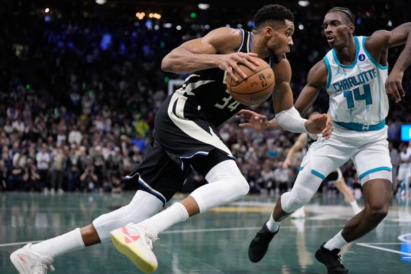 Nov 14, 2025; Milwaukee, Wisconsin, USA;  Milwaukee Bucks forward Giannis Antetokounmpo (34) drives for the basket against Charlotte Hornets forward Moussa Diabate (14) during overtime at Fiserv Forum. Mandatory Credit: Jeff Hanisch-Imagn Images
