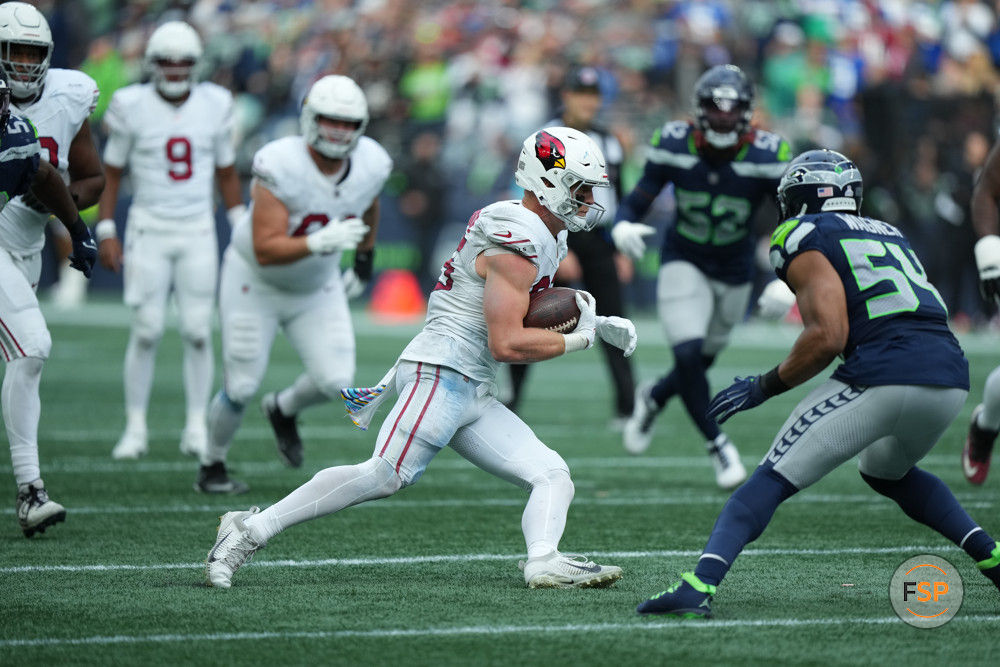 SEATTLE, WA - OCTOBER 22: Arizona Cardinals tight end Trey McBride (85) runs for extra yards against Seattle Seahawks linebacker Bobby Wagner (54) during an NFL game between the Seattle Seahawks and the Phoenix Cardinals on October 22, 2023, at Lumen Field in Seattle, WA. (Photo by Jeff Halstead/Icon Sportswire)