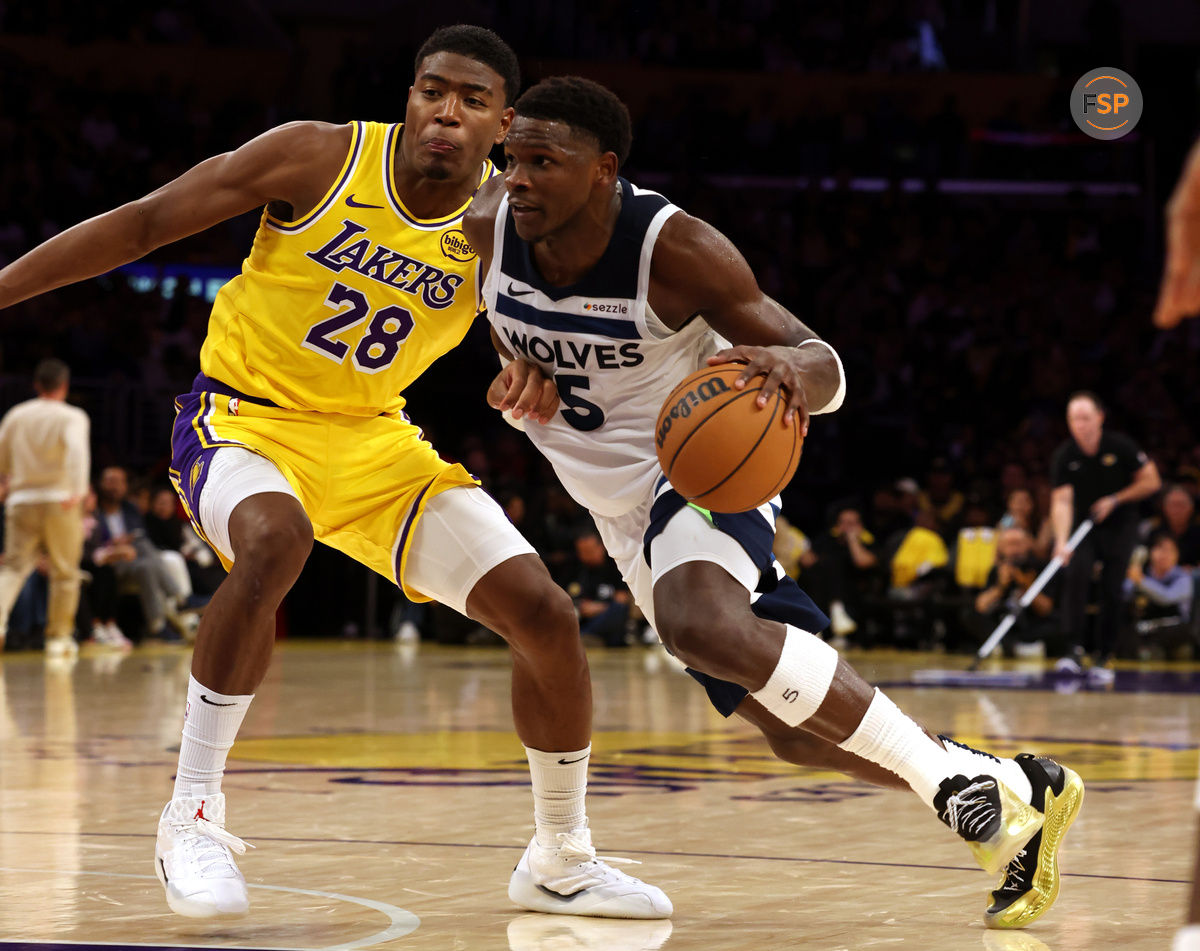 Oct 22, 2024; Los Angeles, California, USA; Minnesota Timberwolves guard Anthony Edwards (5) drives against Los Angeles Lakers forward Rui Hachimura (28) during the fourth quarter at Crypto.com Arena. Credit: Jason Parkhurst-Imagn Images